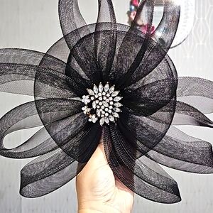 Vintage black hat, crystal brooch. Light fabric.